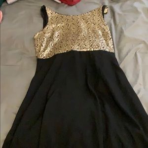 Black dress with gold sequence and bow on back
